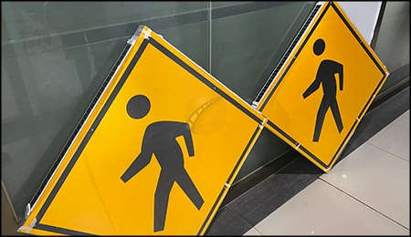 The Role of Pedestrian Crossing Signs on the Road